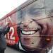 A supporter grabs a photo of Republican presidential candidate Herman Cain's tour bus as it leaves a stop at the Big Sky Diner in Ypsilanti on Thursday morning. Melanie Maxwell I AnnArbor.com
